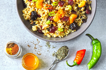 Spicy biryani rice. Vegan rice with dried fruits, spices and chili pepper. Middle Eastern cuisine.