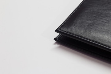 Black wallet isolated on white background with space for text