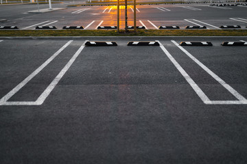 Empty parking lots during Golden Hour sunset at a popular typical Shopping centre