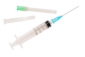 Fototapeta premium Syringe with plastic shell and reserve needle. 2 ml syringe close up, isolate on white background