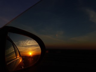 Sunset reflection in the car mirror