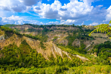 Fototapeta na wymiar Civita di Bagnoregio, walls of canyon around the dying city on a rock