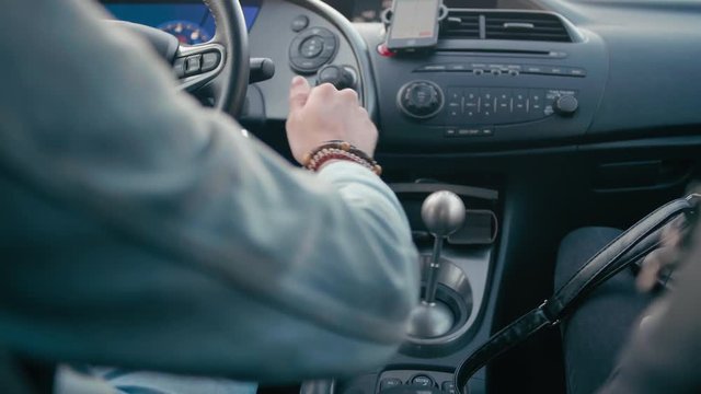 Back View of Man Hand Switching the Fifth Speed by Metal Gear Shift Lever of Manual Transmission GearBox while Driving Car. 4K Slow Motion Stock Video