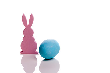 Easter bunny with colorful eggs on a white background
