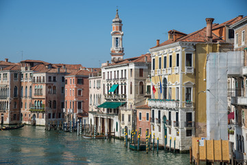 Gondola passing by multicolored buildings