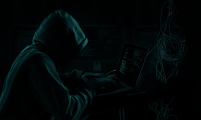 dark web hooded hacker