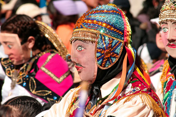 Paucartambo, Cusco, Peru - Circa July 2013: Man wearing a typical mask at Paucartambo's religious festival of Virgen del Carmen. Colorful traditional "Capaq Qolla" dancers with folkloric attire.