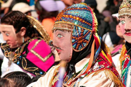 Paucartambo, Cusco, Peru - Circa July 2013: Man wearing a typical mask at Paucartambo's religious festival of Virgen del Carmen. Colorful traditional "Capaq Qolla" dancers with folkloric attire.