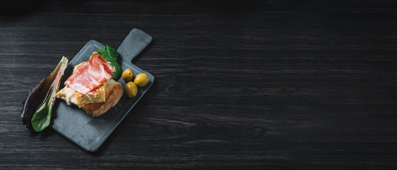  plate with some typical spanish pincho de tortilla and pincho de jamon, copy space for text