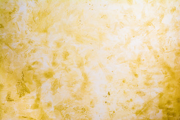 Antique wall surface, yellow texture of decorative plaster, architecture abstraction background