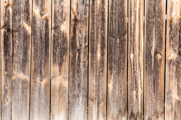 old vertical weathered boards, texture of dark antique wood panels, decor abstraction background