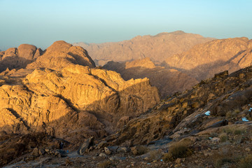 Fototapeta premium Middle East or Africa, picturesque bare mountain range and a large sandy valley desert landscapes landscape photography