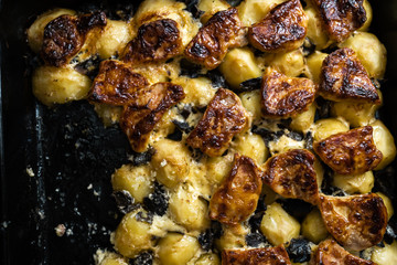 Home baked potatoes with pork meat and mushrooms - Real farmer food and goods from forest