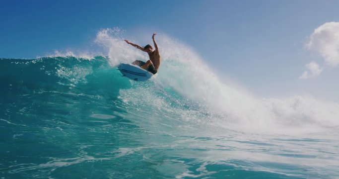 Young surfer ripping in gnarly waves