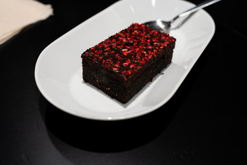 Brownie with with vivid red dry raspberry spices