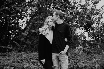 Young Beautiful Couple in Love Being Playful Outside in Nature Laughing and Smiling for Portrait 