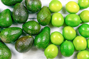 Closeup of fresh avocados and limes
