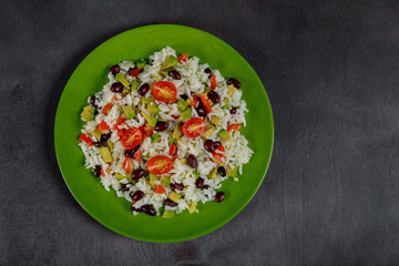 Homemade Mexican with rice, beans, corn, tomato, avocado salad lunch bowl