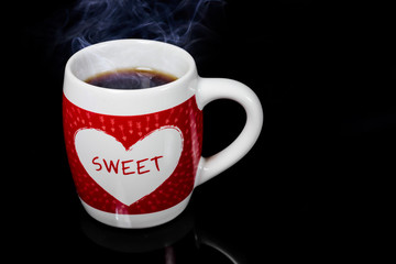 Heart on coffee cup.