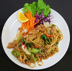Noodle stir fried spaghetti spicy chili pork and green pepper seed