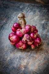 Shallot. It’s a type of onion. Just like onion nutrition and garlic. Some of the impressive health benefits of shallots include their ability to lower cholesterol levels and lower blood pressure.