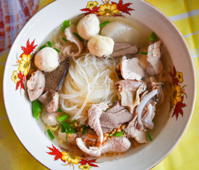 Noodles soup bowl with pork meat ball and vegetables traditional thai and chinese style food of asian