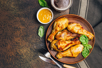 Roasted chicken legs cooked with sauce from mustard and olive oil