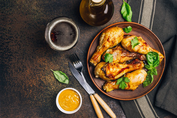 Roasted chicken legs cooked with sauce from mustard and olive oil