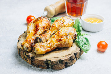 Roasted chicken legs cooked with sauce from mustard and olive oil