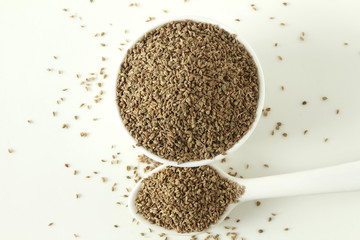 ajwain or Trachyspermum ammi,caraway herb spice seeds in bowl and spoon