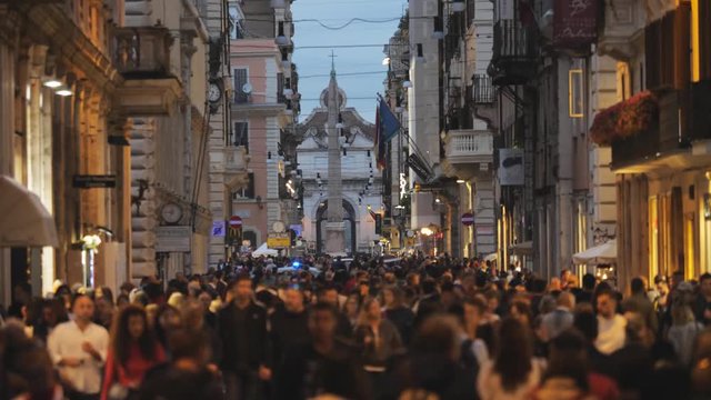 Night crowded shopping street in Rome city center