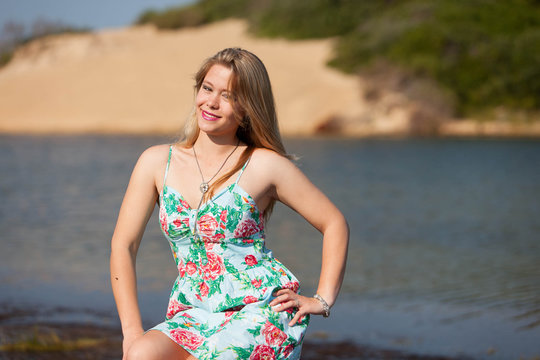woman on the beach in a colorful summer dress