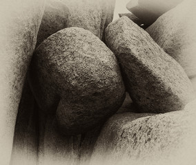 black and white photo of sea stones round and triangular