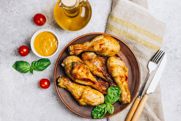 Roasted chicken legs cooked with sauce from mustard and olive oil