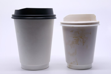 dirty brown stain on take away cup for hot coffee drink, paper mug on white background