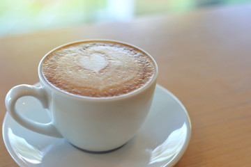 hot latte coffee drink put on wooden table in cafe restaurant, breakfast in the morning day
