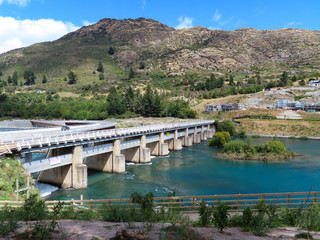 Old and new bridges and obsolete dam over Lake Wakapitu, Queenstown, New Zealand
