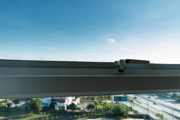 Fototapeta na wymiar glass window in condominium with clear blue sky background