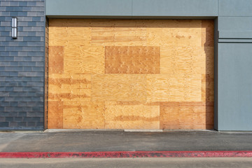 Preparation for hurricane - store, restaurant boarded up with plywood sheets. Plywood shutters...