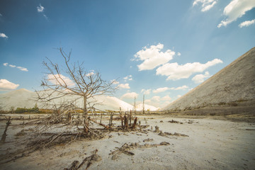 Slopes of white waste. Mountains of waste chemical plant. Salt heaps. Scorched barren desert. Dead soil. Postaocalyptic landscape.