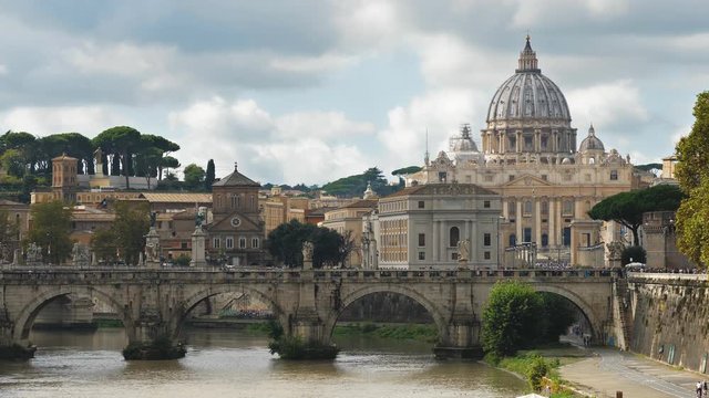 The bridge Ponte Vittorio Emanuele and the Papal Basilica of San Pietro (St. Peter church) in Vatican City seen from Ponte Sant Angelo (St. Angel Bridge) over Tiber river (Fiume Tevere)