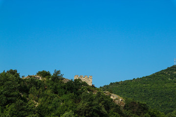 Fototapeta na wymiar panoramic view of the green mountains with ruins of old medieval castle with blue sky, Serbia