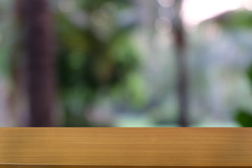 Empty dark wooden table in front of abstract blurred bokeh background of restaurant . can be used for display or montage your products.Mock up for space.