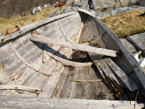 Wooden traditional Norwegian boat on the fjord coast