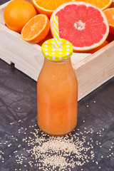 Freshly blended coctail from citrus fruits and other ingredients. Slimming, diet and healthy...