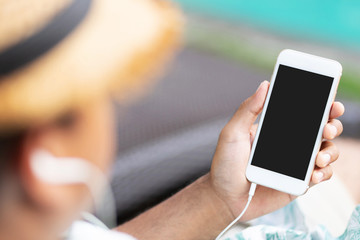 man is using phone to listen to music online