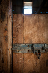 Iron latch lock on a wooden door