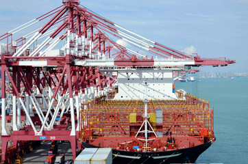Container ship arrived for her cargo in port of Qingdao, China.