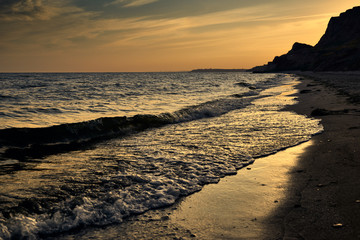 beautiful sunset, sea landscape, sea coast with high hills, wild nature