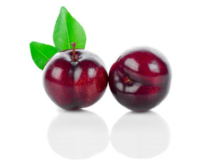 Red cherry plum with leaf isolate on white backgrounds.